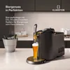A beer dispenser is shown on a kitchen counter, with a glass of beer being poured. Produktbild-Vorschau