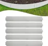 A curved garden border made of metal, with several straight metal pieces laid out below it. Náhled obrázku produktu