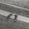 A close-up view of two zippers on a gray fabric surface. Produktbild-Vorschau