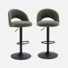 Two khaki bar stools with black bases and adjustable height mechanisms are shown against a light gray background. Produktbild-Vorschau