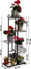 A black metal plant stand with multiple tiers, holding various potted plants. Dimensions are indicated with measurement lines and text. Náhľad obrázku produktu