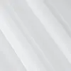A close-up view of white pleated fabric, likely a curtain or textile. Voir les images du produit