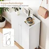 A white shoe cabinet with decorative items on top, and an inset diagram showing anti-tip hardware. Produktbild-Vorschau