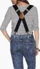Back view of a person wearing black suspenders over a striped shirt and acid-wash jeans. Anteprima dell’immagine prodotto