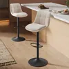 Two beige bar stools are placed in a modern kitchen setting, with one in the foreground and another in the background. Produktbild-Vorschau