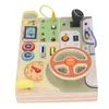 A wooden toy steering wheel board with various interactive elements for toddlers. Náhled obrázku produktu