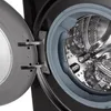 Close-up view of the inside of a washing machine drum and the open door. Produktbild-Vorschau