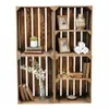 Four wooden crates arranged in a 2x2 grid, each with shelves, displaying decorative items. Náhled obrázku produktu