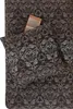 A close-up view of bedding with a damask pattern. Produktbild-Vorschau
