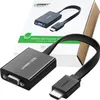 A product shot of an HDMI to VGA converter with its packaging in the background. Voir les images du produit