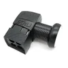 A black satellite dish LNB with a ribbed neck and a four-port output on a white background. Produktbild-Vorschau