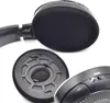 Close-up view of disassembled headphone ear pads and part of the headphone housing. Produktbild-Vorschau
