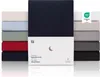 A stack of folded fitted sheets in various colors, with a product package in the foreground. Anteprima dell’immagine prodotto