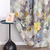 A close-up of a floral patterned curtain draped over a small side table with a framed picture on it. Produktbild-Vorschau