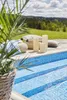 LED candles on a wooden deck next to a swimming pool with a scenic background. Podgląd zdjęcia produktu