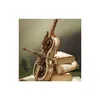 A wooden mechanical cello model is displayed on a stack of wooden books. Voir les images du produit