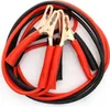 A close-up view of a set of red and black jumper cables with gold clamps. Náhled obrázku produktu