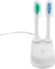 A white charging station for electric toothbrushes with two brush heads attached. Produktbild-Vorschau