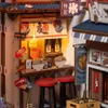 A miniature diorama of a Japanese ramen shop. Voir les images du produit