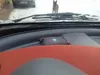 View from inside a car looking out at a dog on a snowy road. Anteprima dell’immagine prodotto