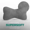A grey bone-shaped pillow with a close-up texture detail and marketing text. Produktbild-Vorschau