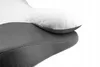 A close-up view of a white and gray orthopedic pillow, showing the textured fabric of both layers. Náhled obrázku produktu