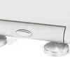 A close-up shot of a white toilet seat with a silver button and silver feet, against a white background. Anteprima dell’immagine prodotto