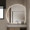 A modern bathroom vanity with a round LED mirror. Produktbild-Vorschau