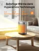A space heater is placed on a coffee table in a living room setting. Produktbild-Vorschau