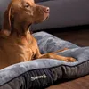 A dog lying on a dog bed. Anteprima dell’immagine prodotto