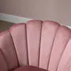 Close-up of a pink velvet chair with a scalloped back. Náhľad obrázku produktu