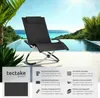 A black lounge chair is positioned by a swimming pool with a tropical background. Náhled obrázku produktu