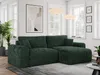 A dark green corduroy sectional sofa is shown in a well-lit living room setting, with large windows in the background.