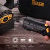 A hand holding a black and yellow electric screwdriver, with a charging base and a black carrying case in the background, all set on a wooden surface. Icons with text describing product features are displayed at the bottom. Produktbild-Vorschau
