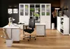 A modern office space with a desk, chair, and storage units. Produktbild-Vorschau