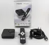 A product shot of a streaming box and its accessories laid out on a white background, with the product packaging in the background. Produktbild-Vorschau