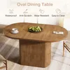 An oval dining table with a fluted pedestal base, set in a dining room with chairs and a rug. Podgląd zdjęcia produktu