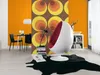 A modern living room with a retro-inspired wallpaper and a unique egg-shaped chair. Produktbild-Vorschau