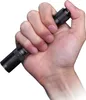 A hand holding a black flashlight. Náhled obrázku produktu