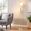 A modern living room scene with a chair and a floor lamp. Náhľad obrázku produktu