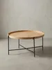 Moderner runder Couchtisch mit 78 cm Durchmesser vor weißem Hintergrund, mit heller Eichenholz-Tischplatte und elegantem, schwarzem Metallgestell in Kreuzform._#sku_BARWL6.493# Produktbild-Vorschau