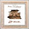 A framed picture of a woman standing in front of a rustic wooden building. Produktbild-Vorschau