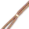 A close-up shot of a braided cord with a gold clasp. Produktbild-Vorschau