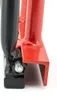 A close-up view of the connection point between two metal components of a tool, one black and one red, with a silver pin visible. Náhľad obrázku produktu