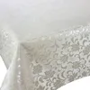 A close-up view of a tablecloth with a floral pattern. Produktbild-Vorschau