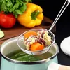 A stainless steel skimmer with corn and carrots is being used to cook vegetables in a pot. Produktbild-Vorschau