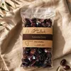 Gaia Kallisti Kalamata-Oliven 250 g auf beigem Leinentuch Produktbild-Vorschau