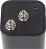 Close-up view of the top of a black 6V battery, showing the two spring terminals and polarity markings (+ and -). Voir les images du produit