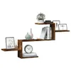 A wooden wall shelf with various decorative items placed on it. Produktbild-Vorschau