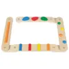 A wooden balance beam toy with colorful pegs and stones. Produktbild-Vorschau